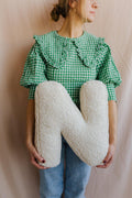Boucle letter cushion N Teddy pillow by bettys home held by young mom in green shirt as birthday gift idea