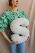 Boucle letter cushion S teddy pillow by bettys home held by woman in green shirt baby shower gift idea
