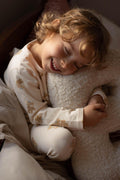 little boy hugging Boucle Letter Cushion by Bettys Home