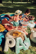 little girl during garden party with letter pillow p and a by bettys home